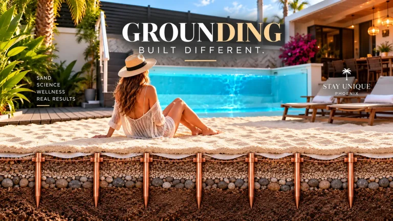 Guest seated on the private white sand area beside a pool