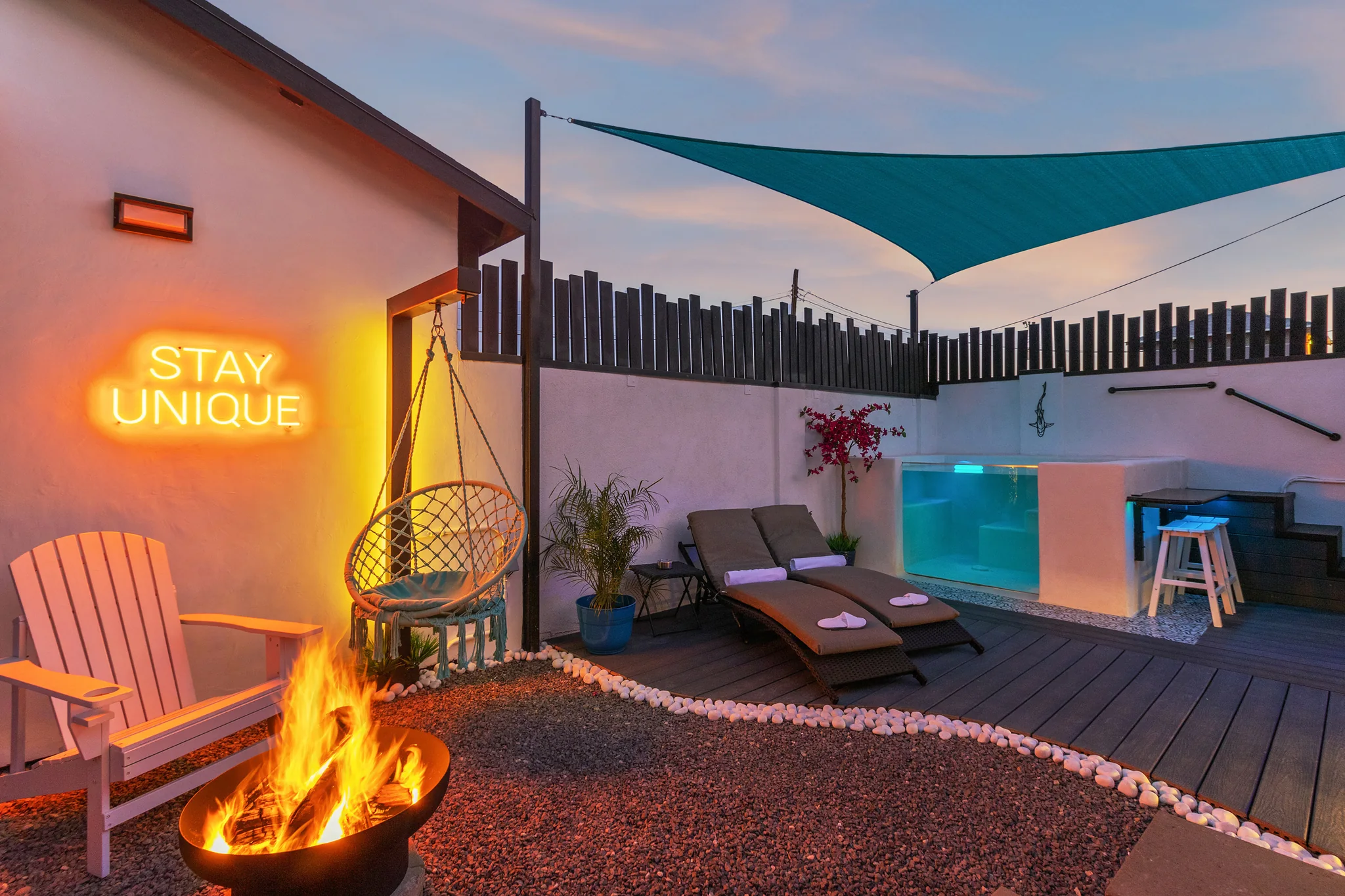 Solace fire pit and private pool at twilight