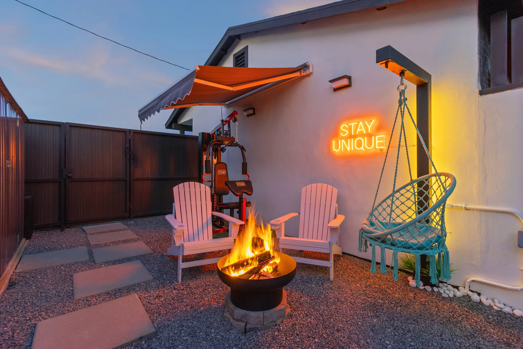 Solace fire pit seating area at twilight